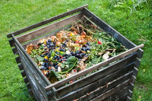 Segregated bins for timber, metal and mixed recycling in a sustainable rubbish area